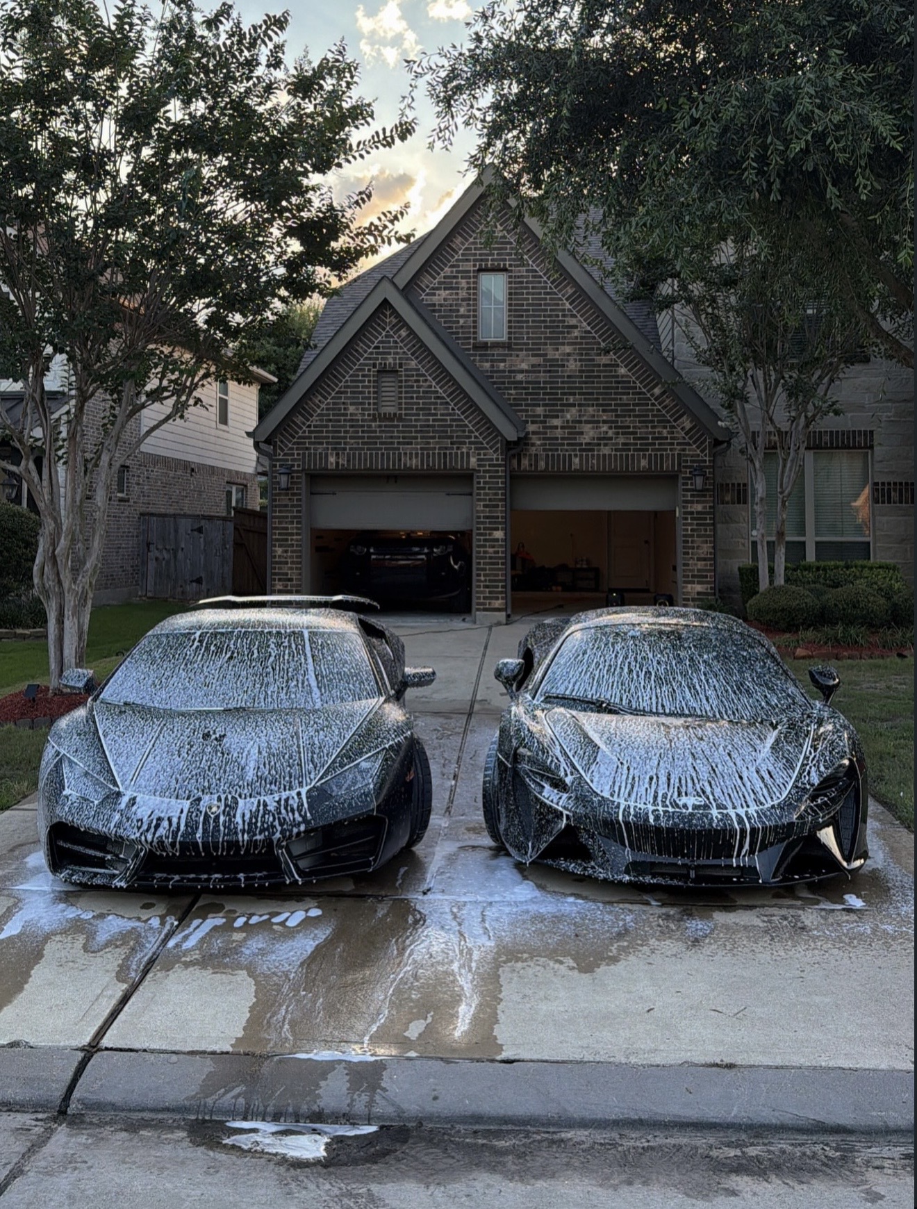 Two supercars covered in detailing foam